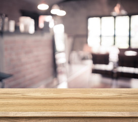 Empty wood table and blurred cafe light background. product disp