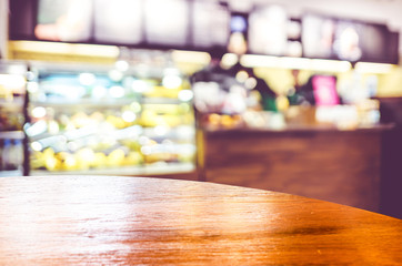 Empty round table top at coffee shop blurred background with bok