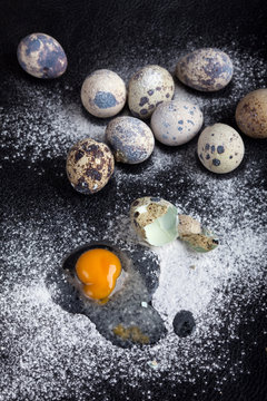 One quail egg broken into flour