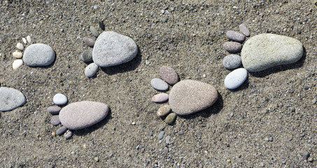 Fototapeta na wymiar foot prints of stones on beach Lesvos