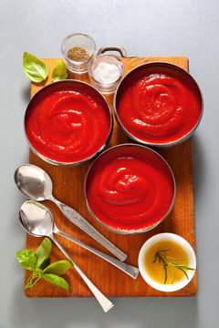 healthy tomato soup with fresh basil leaves . salt & pepper. on