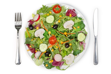 top view of a mixed salad plate, fork and knife