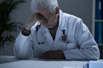 Sick exhausted doctor