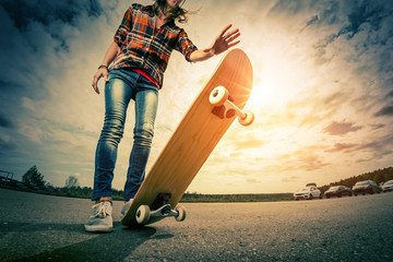 Young lady with skateboard - obrazy, fototapety, plakaty