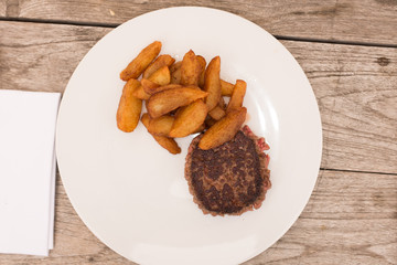 Fried chop, french fries and  Grilled steak Selective focus