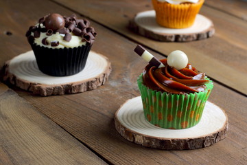 Assortment of cupcakes on a rustic wooden table