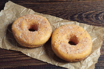 Two donuts on crumpled paper