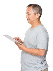 Asian old man use of digital tablet