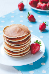 Pancakes traditional homemade sweet dessert with strawberry on