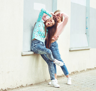 Two Girlfriends Are Hugging And Having Fun