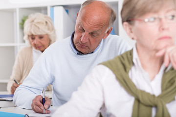 Adult students having test