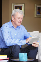 Fototapeta na wymiar Active senior man with tablet