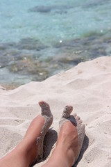 sandy feet on the beach