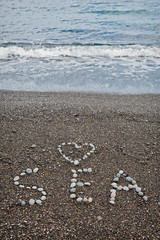 Inscription on the seashore SEA