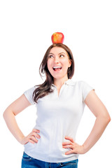 Girl with an apple on her head looking to the side