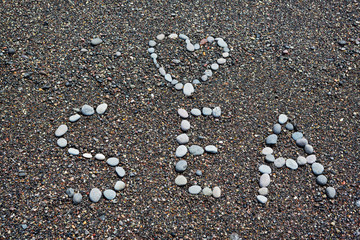 Inscription on the seashore SEA