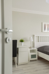 Fototapeta na wymiar Open door to cozy bedroom