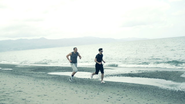 Two man jogging on the beach, super slow motion, 240fps
