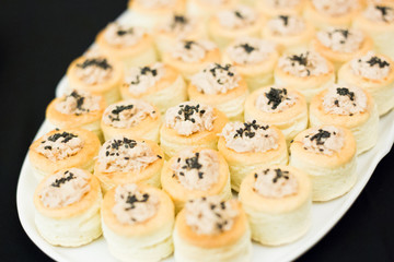 Plate with vol au vent on isolated black background 