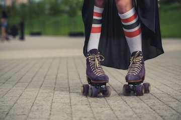 Fototapeta na wymiar female legs in roller skating