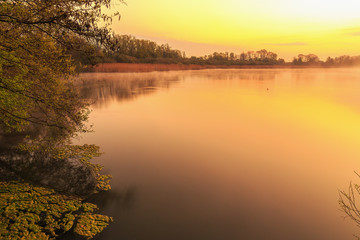 Serene Sunrise at the Lake in Bavaria, Germany. Lovely warm spring morning