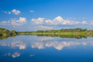 Obraz na płótnie Canvas Calm beautiful rural landscape with a lake 
