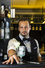 Barman is making a cocktail