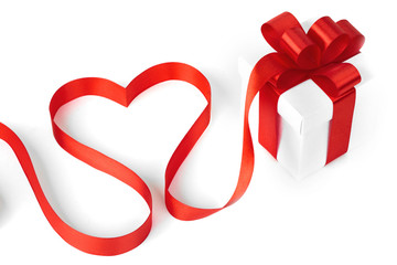 White boxes with red ribbons and decorative heart