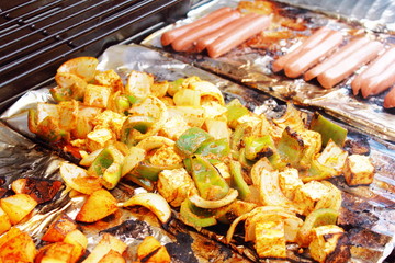 vegetable and hot dog grilling on grill