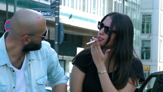 Man Fires Women Cigarette in City