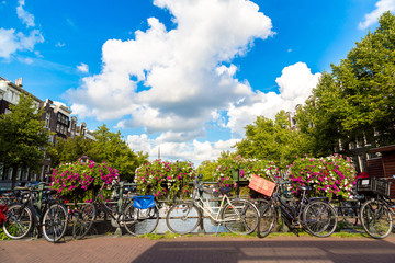 Fototapeta na wymiar Bicycles on a bridge over the canals of Amsterdam