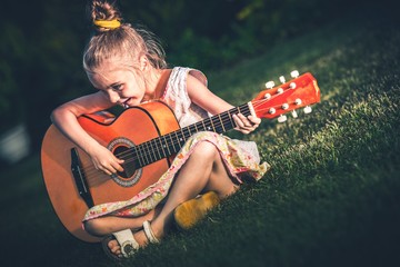 Little Girl Playing Guitar