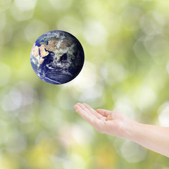 Human hands carrying global Earth. Environment concept. Elements