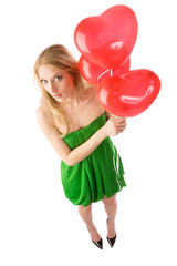 Woman standing with three balloons, top view