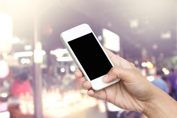 woman hand hold smart phone, tablet,cellphone on blurred lifesty