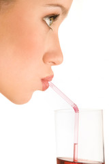 Drinking juice. Side view, close-up