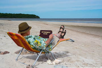 Senior planning retirement on the beach - 85135355