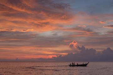 Sunset sky and fisherman
