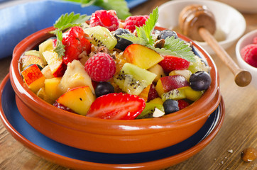Healthy homemade fruit salad with honey.
