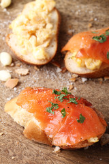Scrambled eggs with smoked salmon, on baguette toast