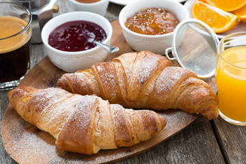 delicious breakfast with fresh croissants on wooden table - obrazy, fototapety, plakaty