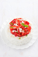 delicious cake with whipped cream and strawberries, vertical