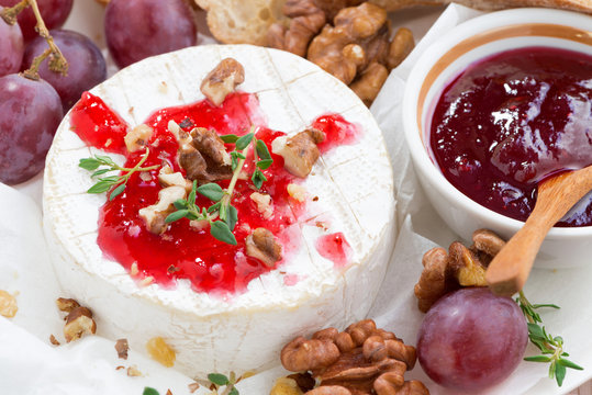 camembert with berry jam, close-up, top view
