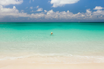 Fototapeta na wymiar Tourist swimming in an empty sea