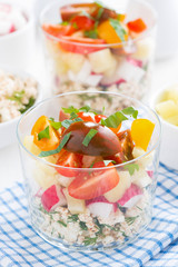 fresh vegetable salad with cottage cheese in a glass, vertical
