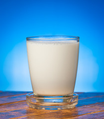 milk on wooden,blue background