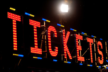 tickets neon sign in the night