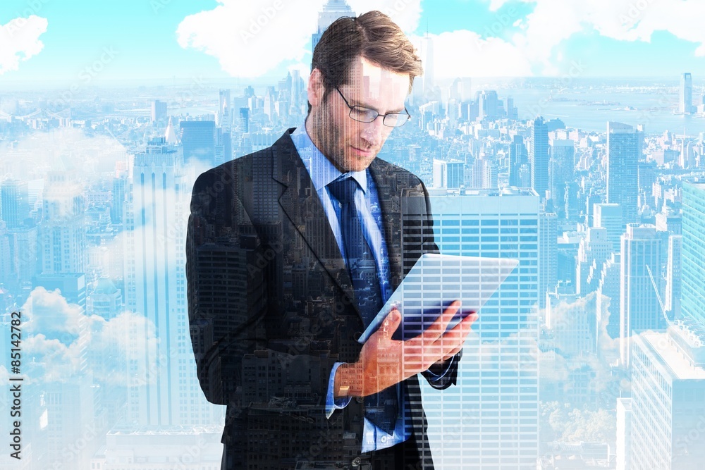 Poster Composite image of businessman using a tablet computer