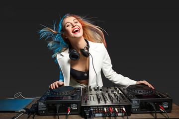 Beautiful blonde DJ girl on decks - the party,