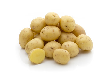 Potatoes on the white background.  New harvest.